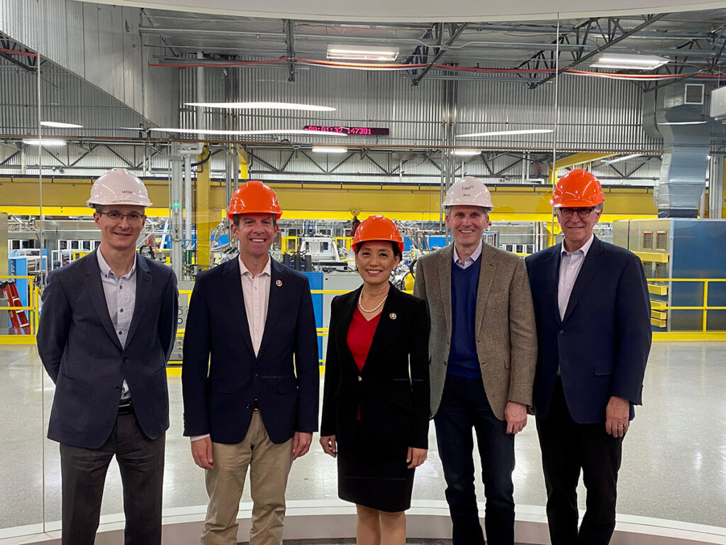 Members of the Congressional Fusion Energy Caucus toured the headquarters of the world’s largest private fusion energy company, TAE Technologies, on May 3, 2023. (From left:) TAE CTO Artem Smirnov, Rep. Mike Levin (CA-49), Rep. Young Kim (CA-40), TAE CEO Michl Binderbauer, and Rep. Don Beyer (VA-08) stand near the company’s National Laboratory-scale fusion energy research device.